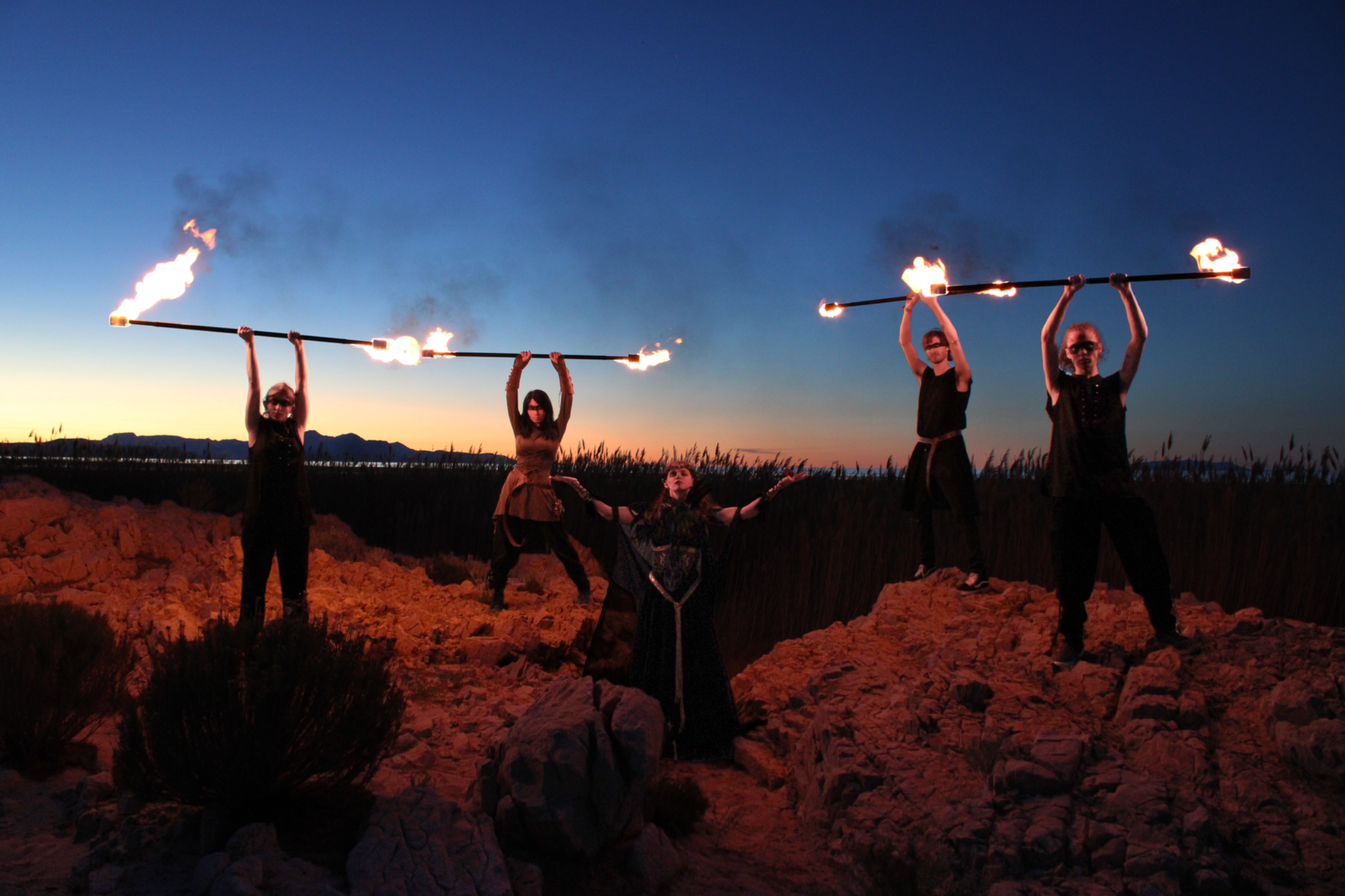Ensemble performance at dusk with fire effects